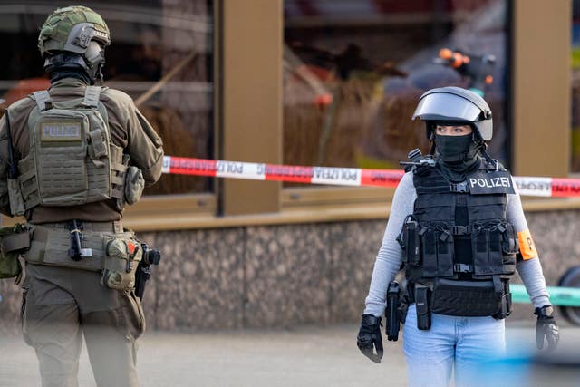 Armed police officers in front of a health club in Duisburg, Germany 
