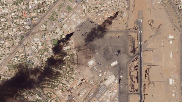 This satellite photo from Planet Labs PBC shows fires burning at Khartoum International Airport in Sudan