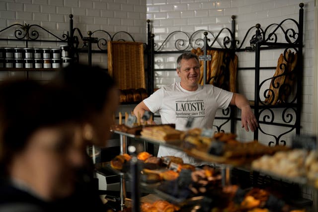 Owner of the Modern Bakery, Thierry Rabineau, poses for a picture