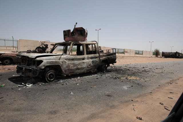 Destroyed military vehicles are seen in southern Khartoum