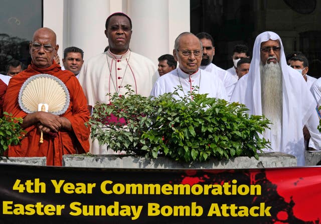 Cardinal Malcolm Ranjith, second right, archbishop of Colombo, stands in silence with other religious leaders during the silent protest