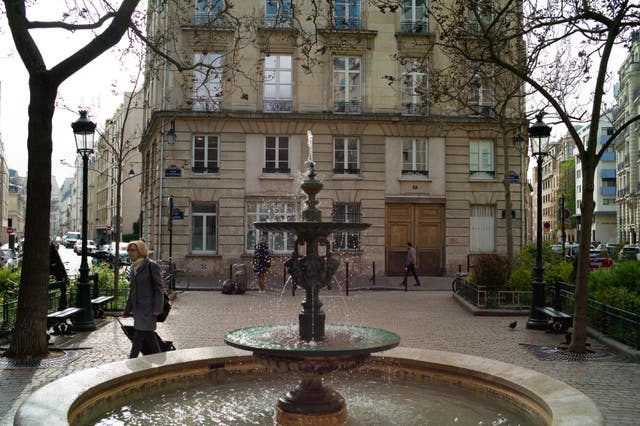 People walk in the Place de d’Estrapade, in Paris