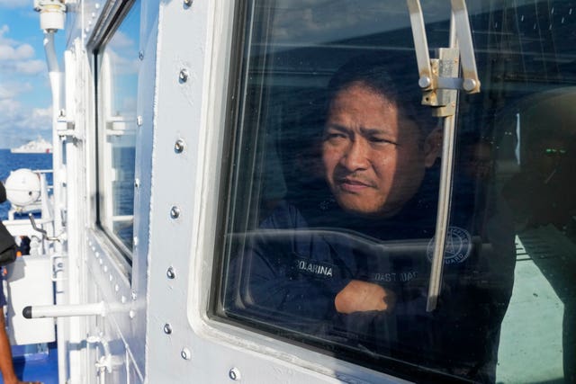BRP Malabrigo’s skipper Julio Colarina III looks from the window of his ship