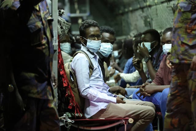 The first group of Kenyan evacuees from Sudan arrive at Jomo Kenyatta International Airport in Nairobi, Kenya, Monday