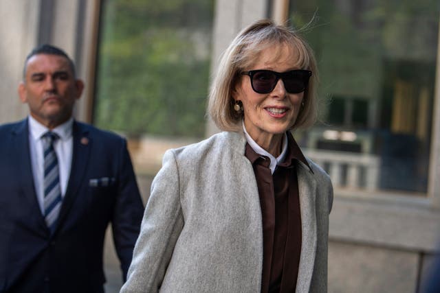 Ms Carroll smiles as she walks into court