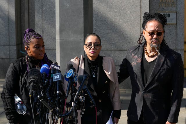 Kathryn Townsend Griffin, centre, the daughter of singer and songwriter Ed Townsend, speaks outside court before the  hearing starts