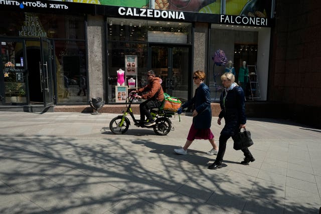 People walk past Calzedonia in Moscow