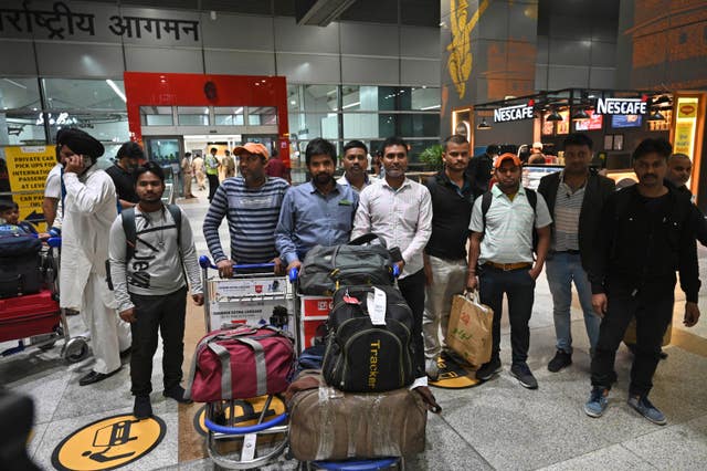 Indians evacuated from Sudan arrive on a flight at the Indira Gandhi International Airport in New Delhi