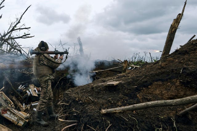 A Ukrainian soldier fires an RPG towards Russian positions at the front line near Avdiivka, an eastern city where fierce battles against Russian forces have been taking place, in the Donetsk region of Ukraine