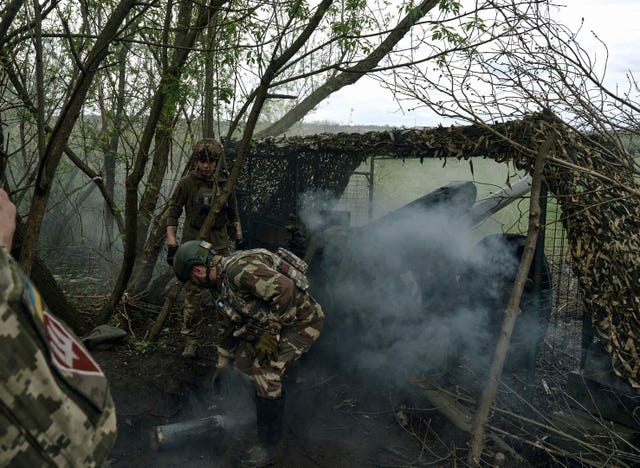 Ukrainian soldiers fire a cannon near Bakhmut, an eastern city where fierce battles against Russian forces have been taking place, in the Donetsk region, Ukraine 
