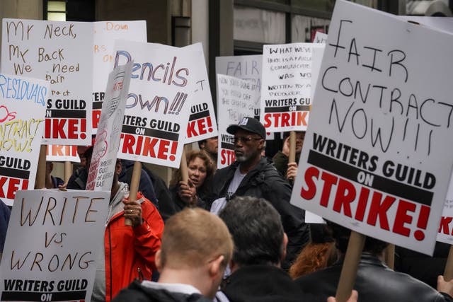 Striking writers march and picket calling for better wages outside Peacock NewFronts in New York