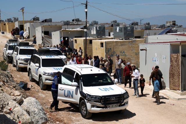 A UN convoy arrives at a camp in Idlib, Syria, following the recent earthquake