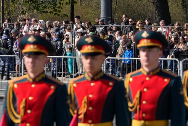 People watch a rehearsal for the Victory Day military parade in St Petersburg 