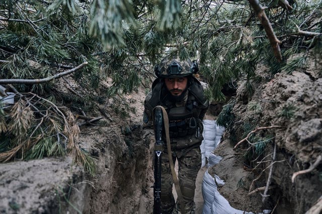 A Ukrainian soldier in a trench 