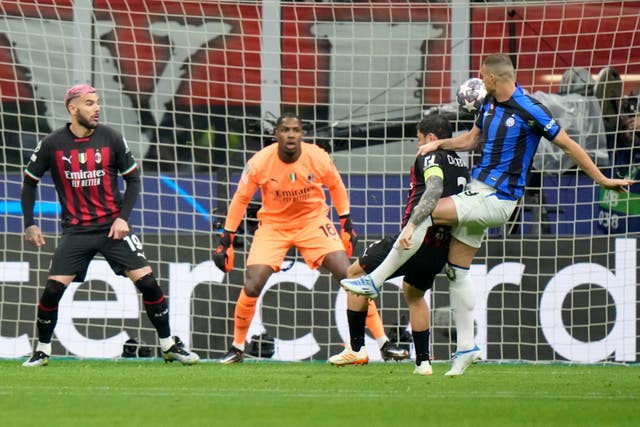 Dzeko, right, volleys in Inter's opener