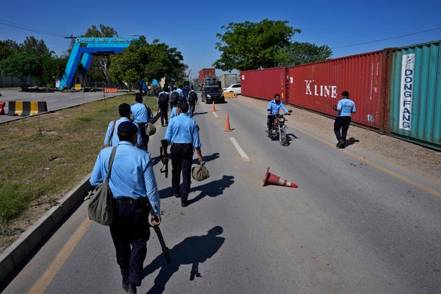 Riot police officers move to take positions in the vicinity of police headquarters 