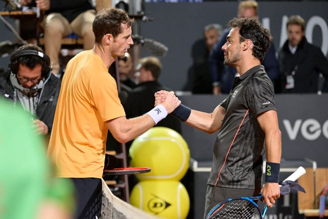 Andy Murray, left, and Fabio Fogini shake hands