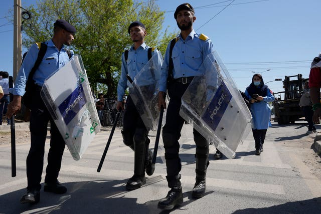 Riot police officers outside police headquarters 