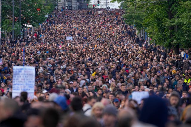 People march during a rally against violence in Belgrade on May 12 