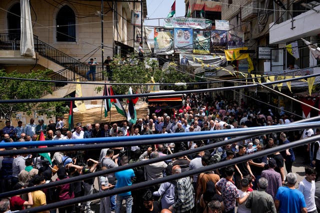 People shout slogans against Israel and in support of people in the Gaza Strip, during a protest at the Burj al-Barajneh Palestinian refugee camp, south of Beirut, Lebanon