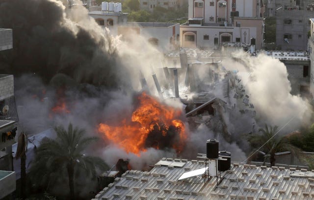 Smoke and fire rise from an explosion caused by an Israeli air strike targeting a building in Gaza