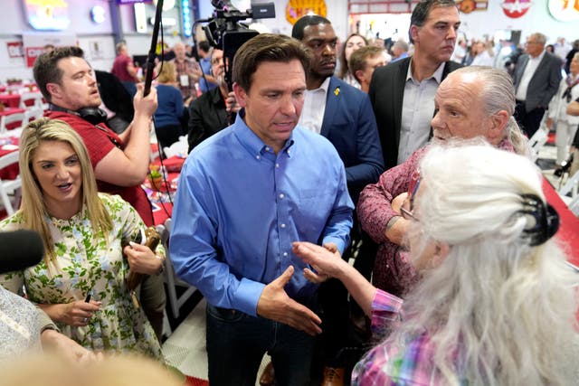 Florida governor Ron DeSantis greets audience members during a fundraising picnic for US Representative Randy Feenstra in Sioux Centre, Iowa