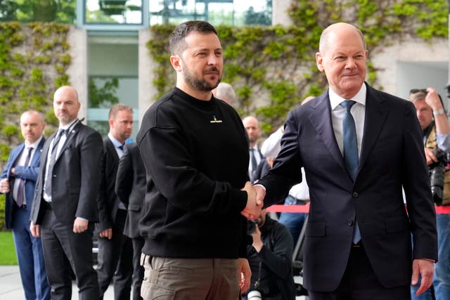 Germany’s chancellor Olaf Scholz, right, greets Ukraine’s president Volodymyr Zelensky at the chancellery in Berlin 