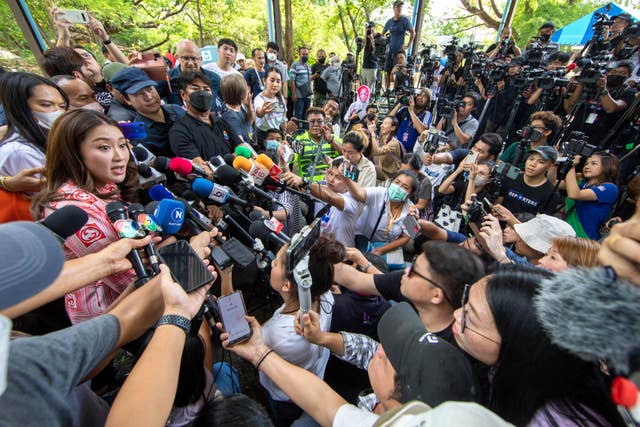 Paetongtarn Shinawatra, left, speaks to the media in Bangkok 