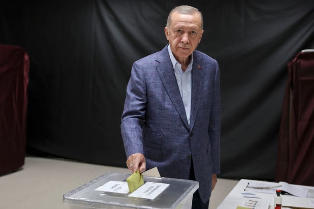 Turkish president Recep Tayyip Erdogan casts a ballot at a polling station in Istanbul 