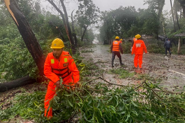 Rescue workers remove the fallen trees in Teknaf, near Cox’s Bazar, Bangladesh 