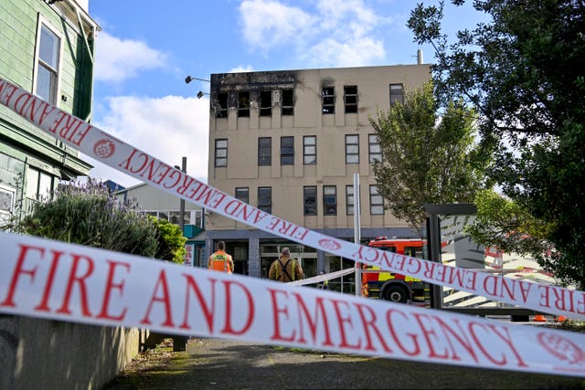 Outside the hostel in the fire's aftermath