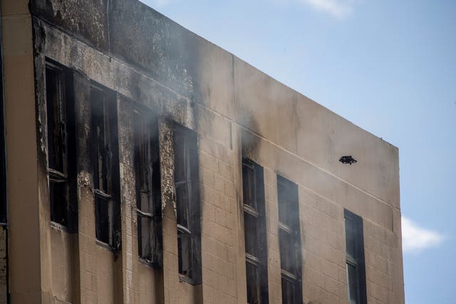 A drone inspects the damage after a fire near a hostel in central Wellington, New Zealand, on May 16
