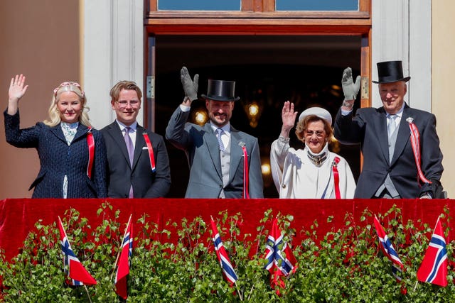 From left: Norway’s Crown Princess Mette-Marit, Prince Sverre Magnus, Crown Prince Haakon, Queen Sonja and King Harald V wave from the balcony at Skaugum, their official residence