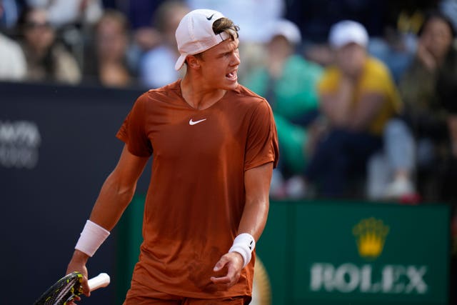 Holger Rune looks frustrated during his loss to Daniil Medvedev 