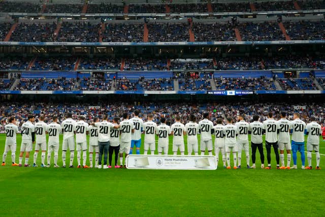 Players of Real Madrid wear jerseys with the name of team-mate Vinicius Junior before their LaLiga match on Wednesday