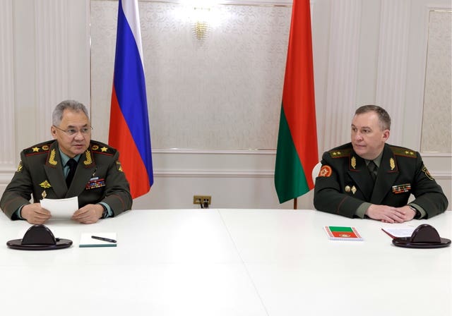 Russian defence minister Sergei Shoigu, left, and Belarusian defence minister Viktor Khrenin speak to the media after a session of the Council of Defence Ministers of the Collective Security Treaty Organisation in Minsk, Belarus