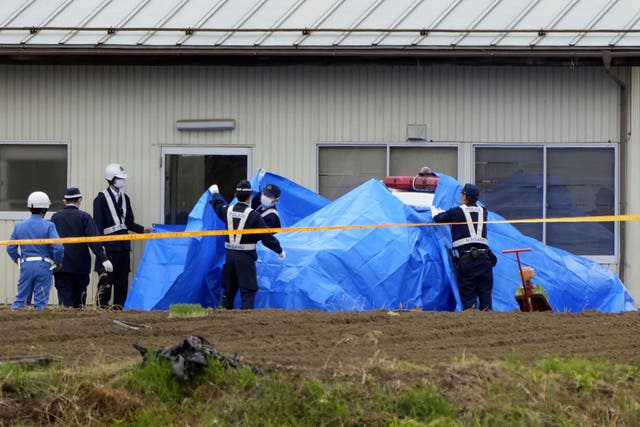 Police with coverings at the crime scene