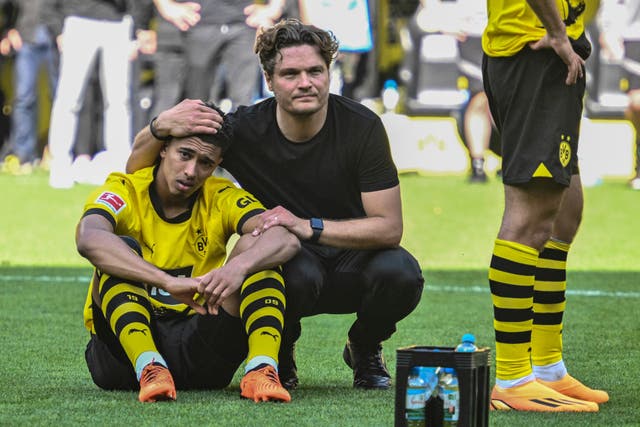 Jude Bellingham is consoled by coach Edin Terzic after Borussia Dortmund miss out on the Bundesliga title