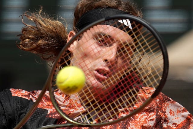 Stefanos Tsitsipas strikes a backhand 