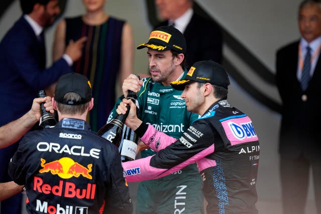 Monaco Grand Prix winner Max Verstappen, Fernando Alonso and Esteban Ocon celebrate