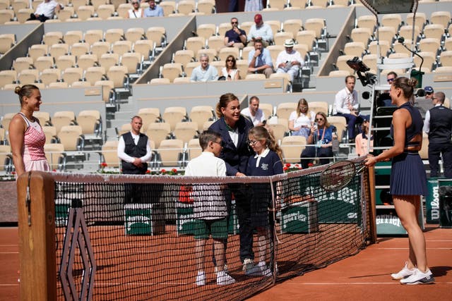 Aryna Sabalenka of Belarus, left, and Marta Kostyuk stand apart before their match in Paris