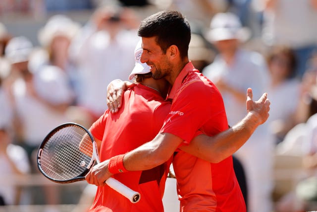 Novak Djokovic embraces Aleksandar Kovacevic after their French Open clash 
