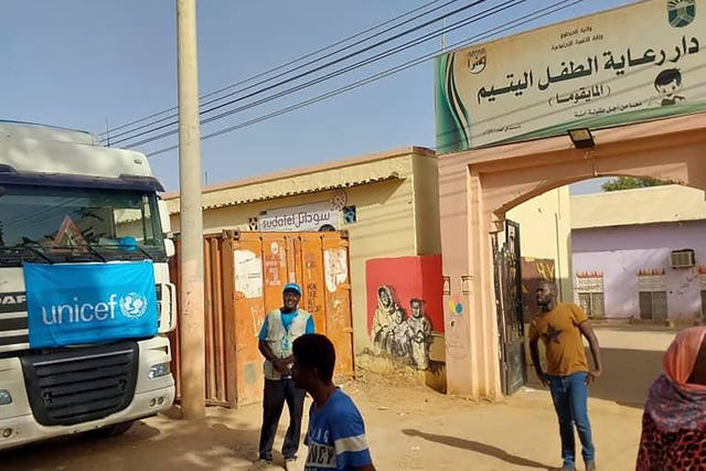 A truck carrying humanitarian assistance from the UN children’s agency stands in front of the Foster Home for Orphans in Khartoum, Sudan, in May
