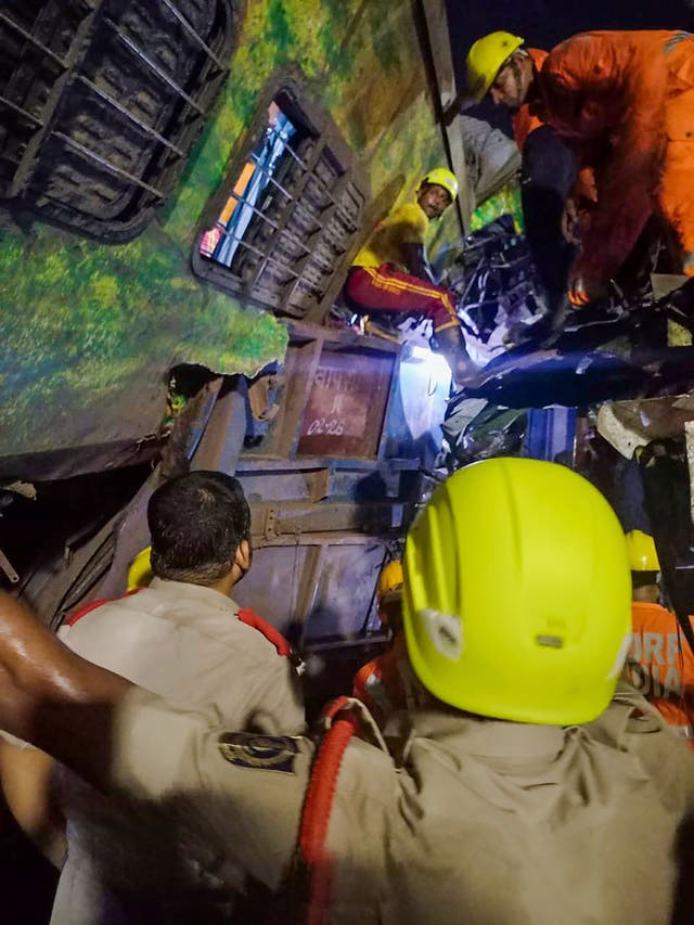 Rescuers work at the site of passenger trains that derailed in Balasore district, in the eastern Indian state of Orissa, Friday, June 2, 2023