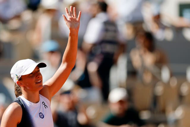 Iga Swiatek celebrates winning her second-round match