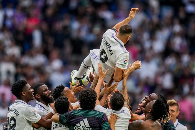Karim Benzema is thrown in the air by team-mates after his final appearance for Real Madrid
