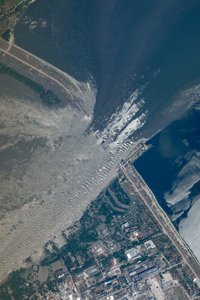 This satellite image provided by Planet Labs PBC shows an overview of the damage on the Kakhovka dam in southern Ukraine 