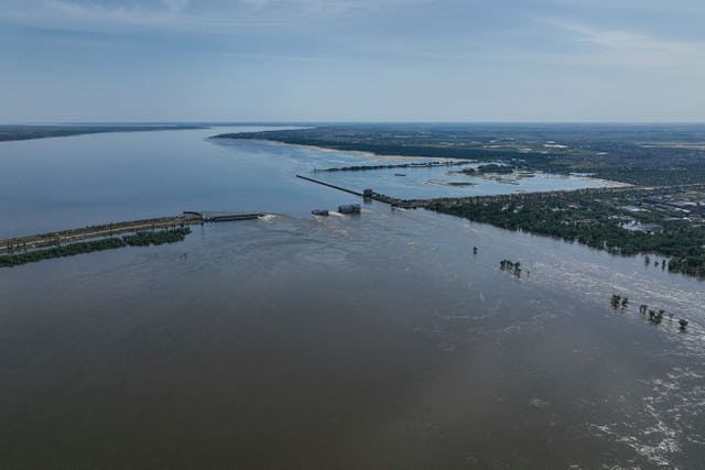 Water flows over the collapsed Kakhovka dam in Nova Kakhovka, in Russian-occupied Ukraine on Wednesday