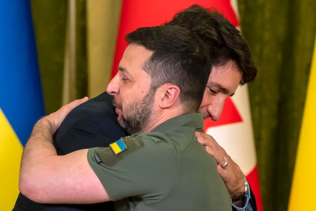 Canada’s Prime Minister Justin Trudeau, left, hugs Ukrainian President Volodymyr Zelensky during a meeting in Kyiv