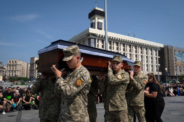 A coffin is carried